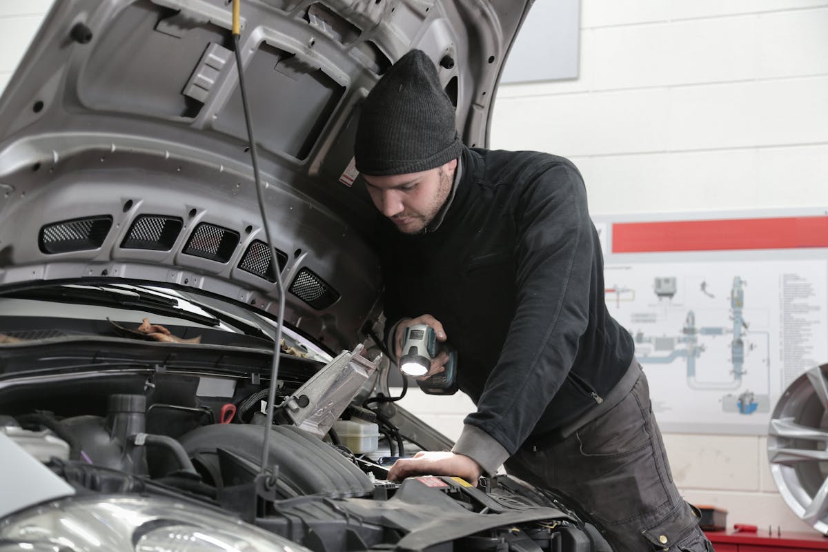 Technician mounting new tire on wheel machine